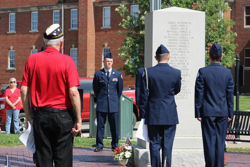 Members of JROTC and Gary Grigsby, of the American Legion, face the memorial as the JROTC members read the names of fallen soldiers during a Memorial Day ceremony hosted Monday morning, May 29 on the Johnson County Courthouse lawn. The ceremony was hosted by American Legion Post 131 and VFW Post 2513.