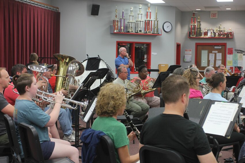 Warrensburg Community Band President David Robinson, standing in the center, overlooks the ensemble's Monday, June 5 rehearsal at Warrensburg High School. Rehearsals for the summer season began this week and performances will kick off at the end of June.