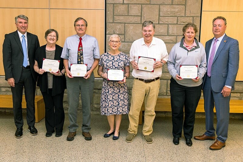 University of Central Missouri President Roger Best, left, and Board of Governors President Kenneth Weymuth, right, presented certificates to UCM employees who have attained emeriti status, from left, Trish Hubbard, David Ewing, Jean Nuernberger, Daniel Crews, and Kathy Anderson, when the board met June 8. Not present for the photo were Becky Landkamer, C. Jo Riggs, Roderick Woolen, and Rick Dixon.   Photo courtesy of the University of Central Missouri