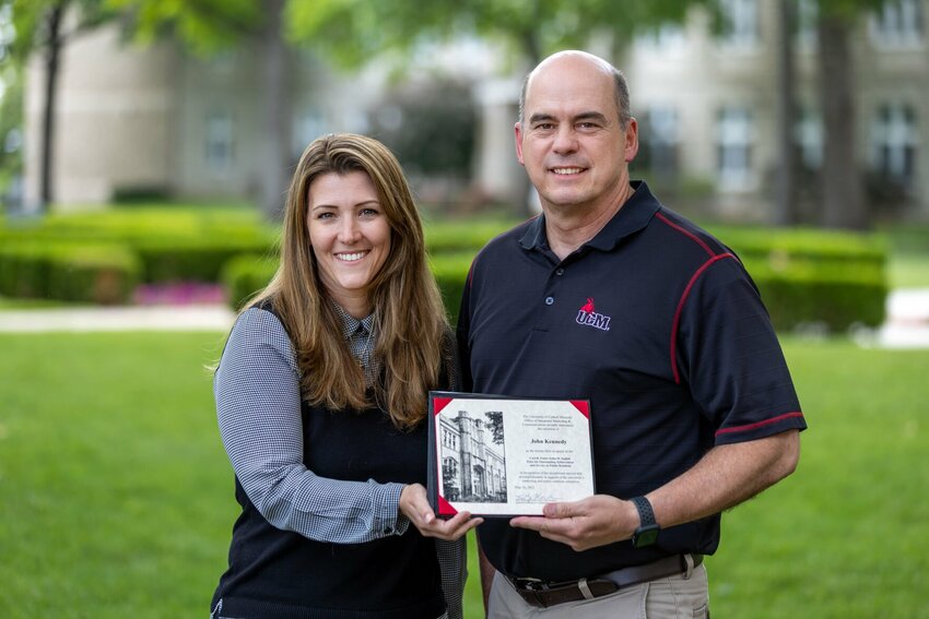 Kelly Waldram Cramer, left, associate vice president of Integrated Marketing and Communications at the University of Central Missouri, honors John Kennedy, video and multimedia producer in IMC, with the Carl B. Foster/John M. Inglish Prize for Outstanding Achievement and Service in Public Relations.   Photo courtesy of the University of Central Missouri