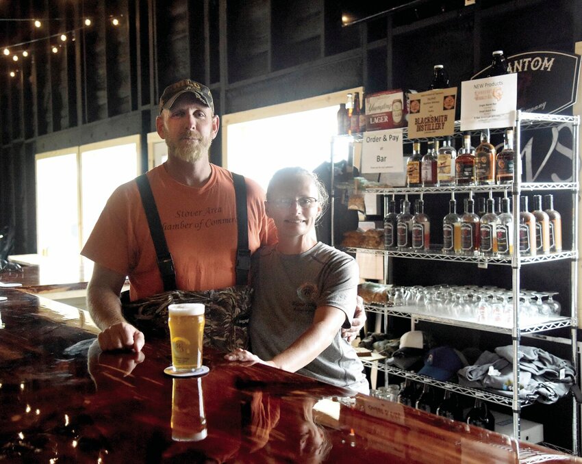 On Friday, July 7, Bryan and Leslie Welpman, owners of Welpman Springs Brewing Co. LLC, stand in their new 50-by-30-foot taproom. The couple not only offers their original beers but many local beers, liquors, and wines. The taproom is open from 1 to 7 p.m. Friday and Saturday.   Photo by Faith Bemiss | Sedalia Democrat