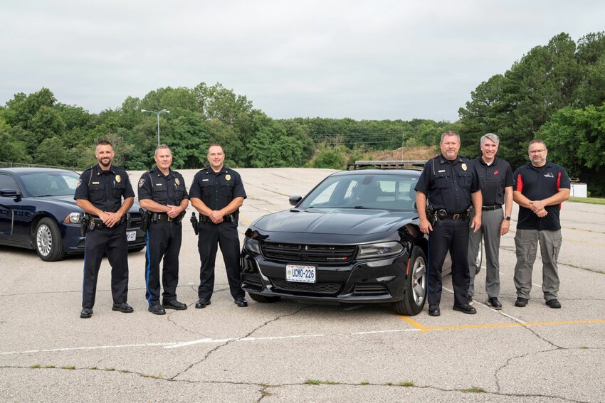Participants in the Sedalia Police Department&rsquo;s formal presentation of a 2017 Dodge Charger with emergency lights to the Missouri Safety Center at the University of Central Missouri included, from left, SPD officers Josh Howell, Adam Hendricks, David Woolery, Police Chief Matt Wirt, UCM President Roger Best, and Missouri Safety Center Senior Program Manager Mike Perkins.