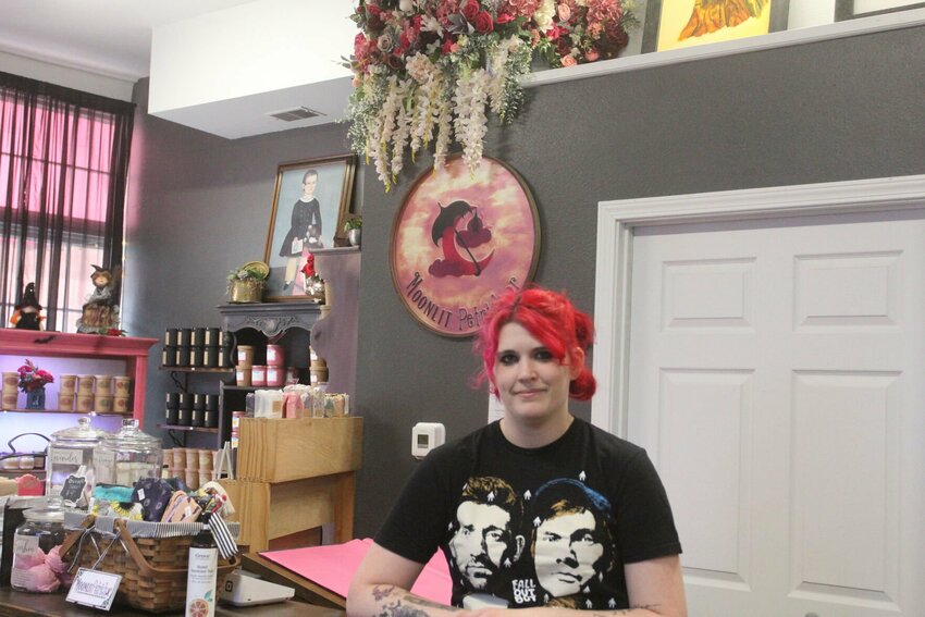Darby Davis stands behind the counter of her shop, Moonlit Petrichor, which has undergone many changes throughout her year of business. &quot;It is one of the best smelling shops you can walk into,&quot; Davis said. &quot;We are inclusive and accepting of everybody. We also try to keep the vibes nice and relaxing around here.&quot;