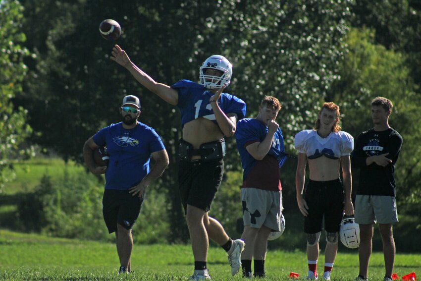 Holden quarterback Aiden Morarity throws a pass in practice Wednesday, Aug. 17, in Holden.
