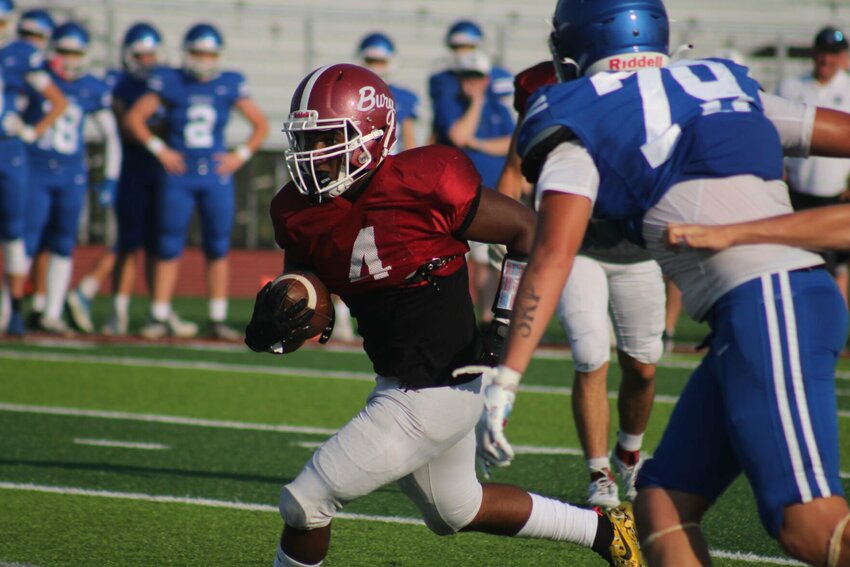 Warrensburg sophomore AJ Smith breaks loose against Summit Christian Academy in jamboree action Friday, Aug. 18 at the Warrensburg Activities Complex.