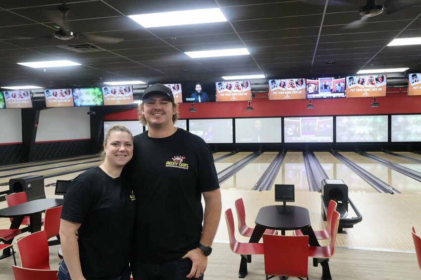 Alley Cats co-owners Miranda and Sterling Wahn stand inside the newly renovated bowling alley on Thursday, Aug. 24. After months of work, the new Warrensburg business opened Aug. 18.