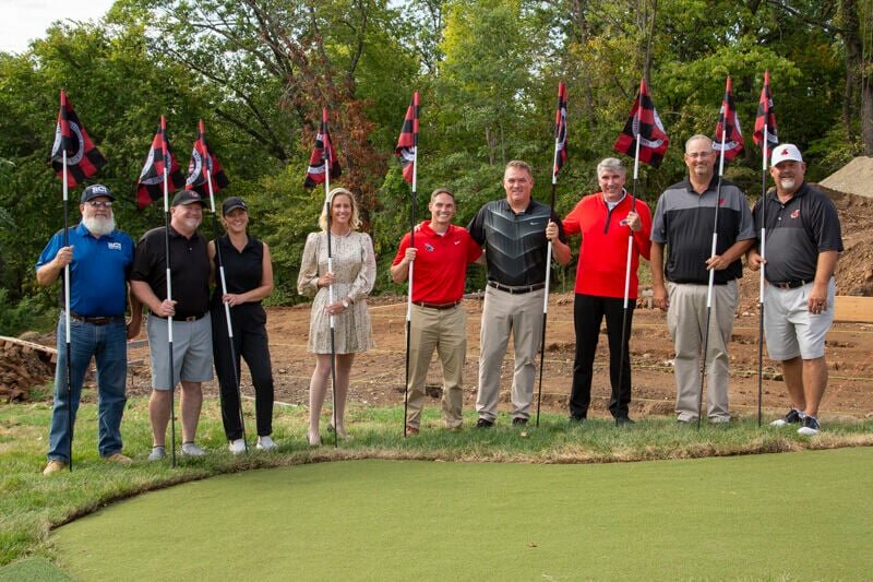 Speakers and special guests participating in a recent ceremony celebrating the launch of construction on the Randall and Kelly Harbert Collegiate Golf Center at the University of Central Missouri included, from left, Randy Eckert, Reasbeck Construction project manager; Matt and Julie Roberts, project donors; Courtney Goddard, vice president for university advancement and executive director of the UCM Alumni Foundation; Matt Howdeshell, vice president for intercollegiate athletics; Rand Harbert, lead donor; Roger Best, university president; Chris Port, Jennies golf coach; and Tim Poe, Mules golf coach.