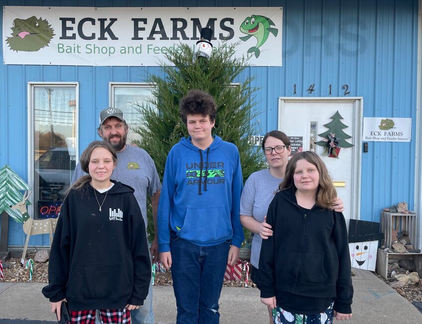 From left, Eddie Hart, along with son Clyde, wife Christina, and daughters Emma and Katy, stand in front of Eck Farms, 1412 S. Maguire St. in Warrensburg. The local business opened its storefront in April.