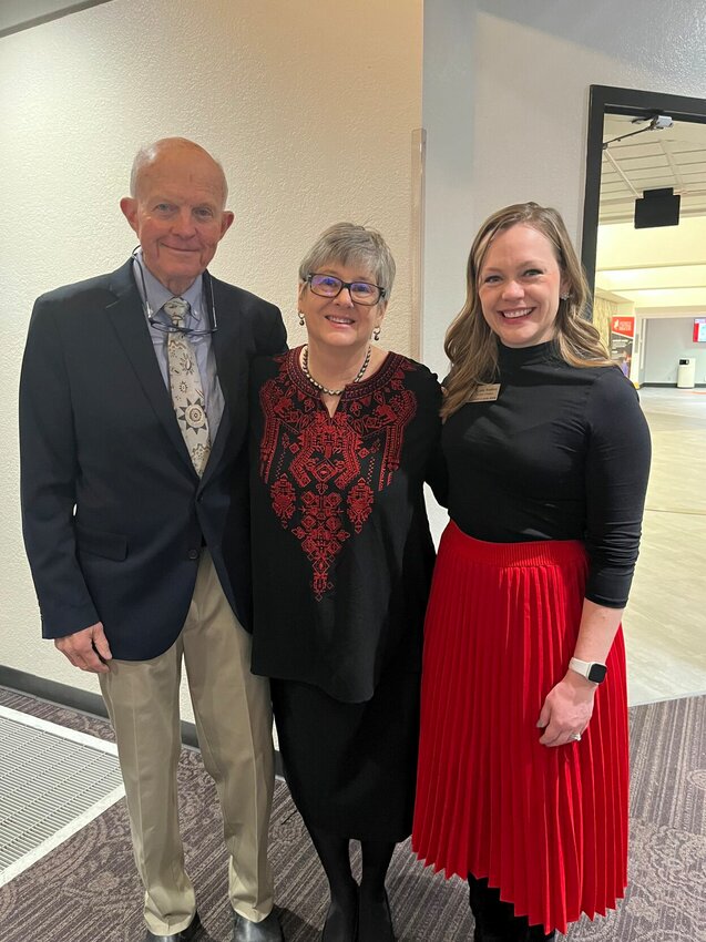 From left, Larry Michaelsen, Mary McCord and Jaclyn Brandhorst pose for a photo at IBE's 100th company celebration on Friday, Dec. 1 at the University of Central Missouri.