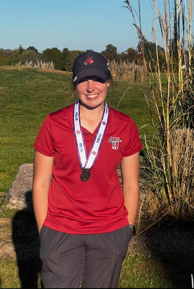 Warrensburg senior Reece Nimmo poses for a photo with her All-State medal Oct. 17, at the Crown Pointe Golf Club in Farmington.