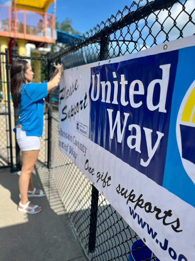 JCUW Executive Director Rachel Mifflin sets up for the United Way&rsquo;s summer quarterly event, a free swim night, on July&nbsp;21 at Nassif Pool.&nbsp;