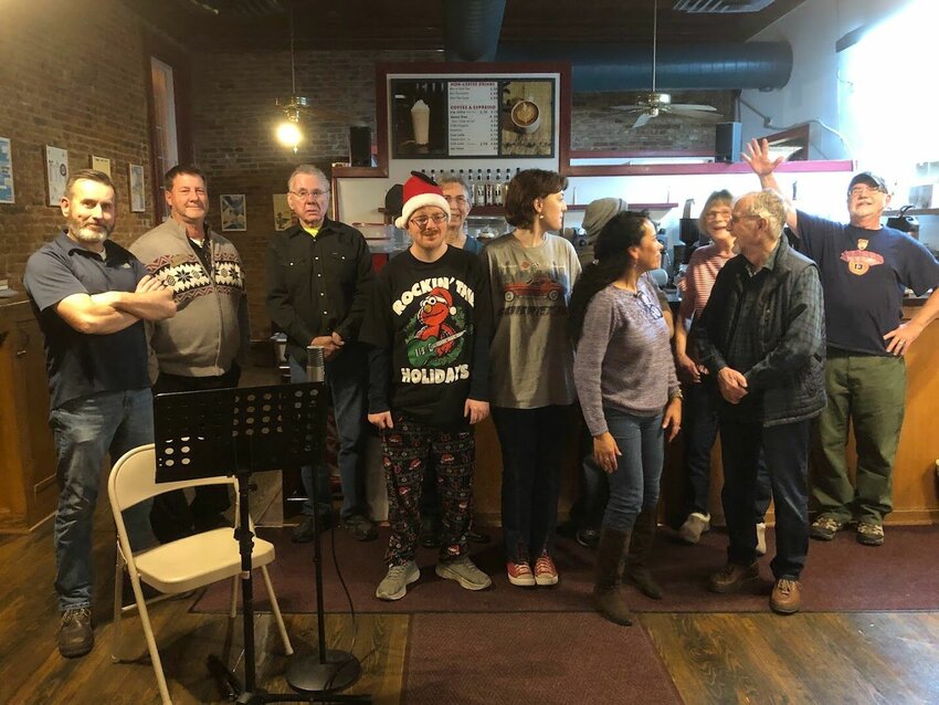 Old Drum Open Mic participants gather for a photo during the December program at Java Junction in downtown Warrensburg.