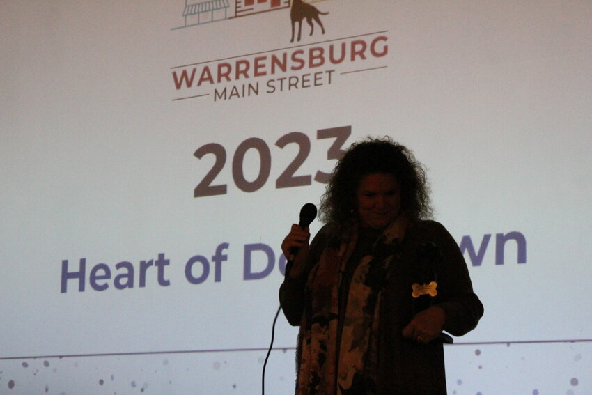 Jill Purvis takes a moment to collect her thoughts before continuing in her acceptance speech on Tuesday, Jan. 23, at the Star Theater. Purvis won the 2023 Heart of Downtown award for her time as the Warrensburg Main Street Executive Director.&nbsp;