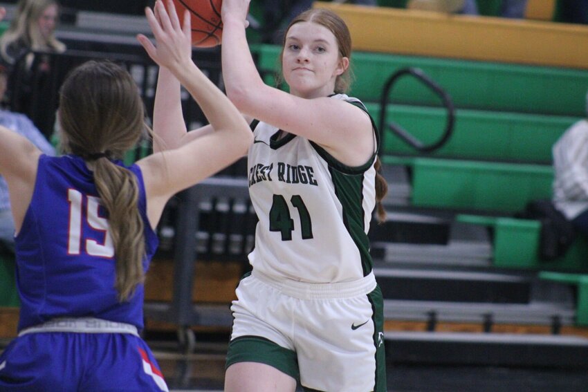 Crest Ridge senior Mady Trobough passes the balla against Lexingto in the F&amp;amp;C Bank Cougar Classic seventh-place game on Friday, Jan. 26, at Crest Ridge High School.