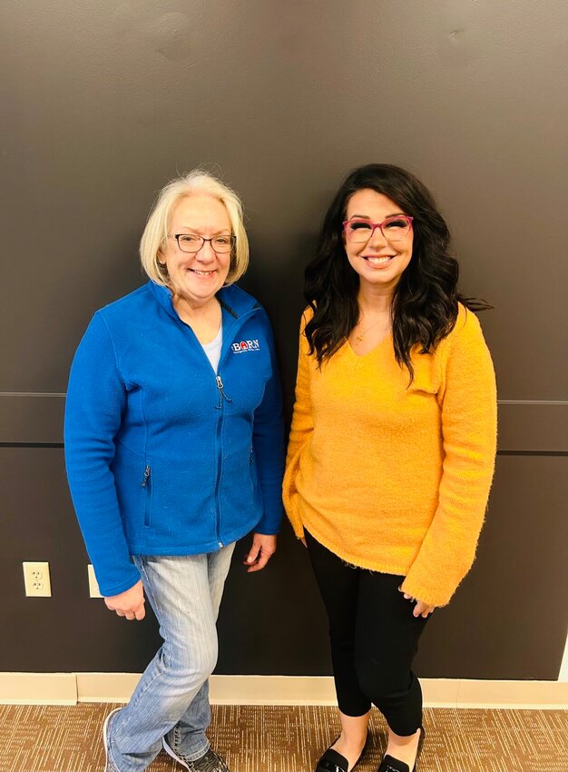 The BARN Therapeutic Riding Center owner Sue Becklenberg, left, and Johnson County Board of Services Executive Director Melissa Frey pose for a photo at the JCBS office, 200 N. Devasher Road, after&nbsp;Becklenberg received notification that The BARN was approved for funding.   &nbsp;