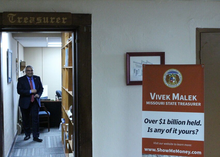 Missouri State Treasurer Vivek Malek smiles in the entryway of the Johnson County Treasurer's Office during his visit on Thursday, Feb. 1, at the Johnson County Courthouse. Johnson County was one of 11 counties Malek visited on Thursday, as he promoted National Unclaimed Property Day.