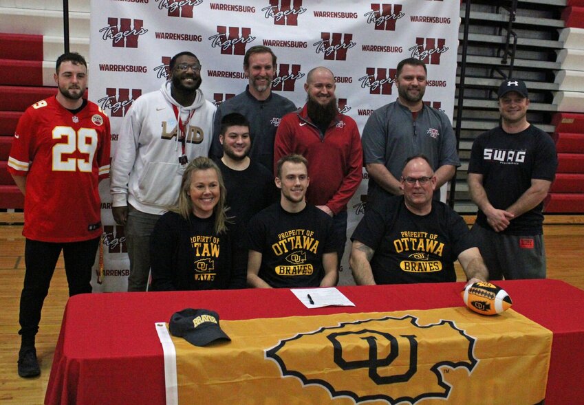 Warrensburg senior Quinn Conley signed his letter of intent to play college football at Ottawa University on Thursday, Feb. 8, at Warrensburg High School.