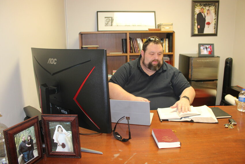 Warrensburg Church of Christ Pastor Daryl Parsons works in his office at the church, 722 S. Maguire St. He joined the congregation in January.