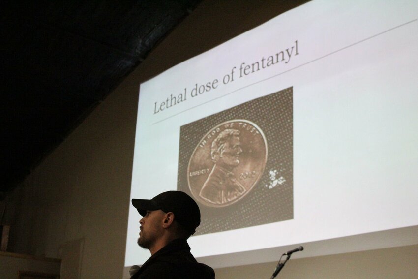 Johnson County Sheriff's Department Detective Chase Jackson presents an image of a lethal dose of fentanyl in comparison to a penny on Wednesday, March 13, at the Covenant Church of Holden.&nbsp;A gram of fentanyl is enough to overdose and kill anyone.&nbsp;