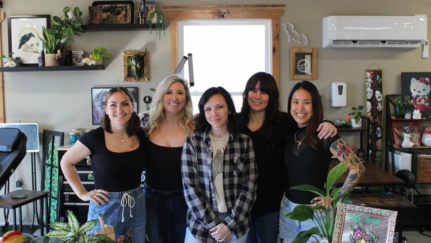 From left, tattoo artists Renee Catledge, Katy Lightburne, Lauren Hall, Marimi Heyde, and Cat Garden pose for a portrait on Tuesday, March 12, at the Gallery Tattoo Studio in Knob Noster.&nbsp;