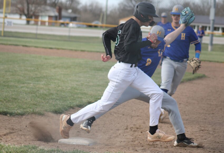 Crest Ridge junior Wyatt Ducos finishes off a single against Lafayette County on Saturday, March 16, at the Knob Noster Sports Complex.