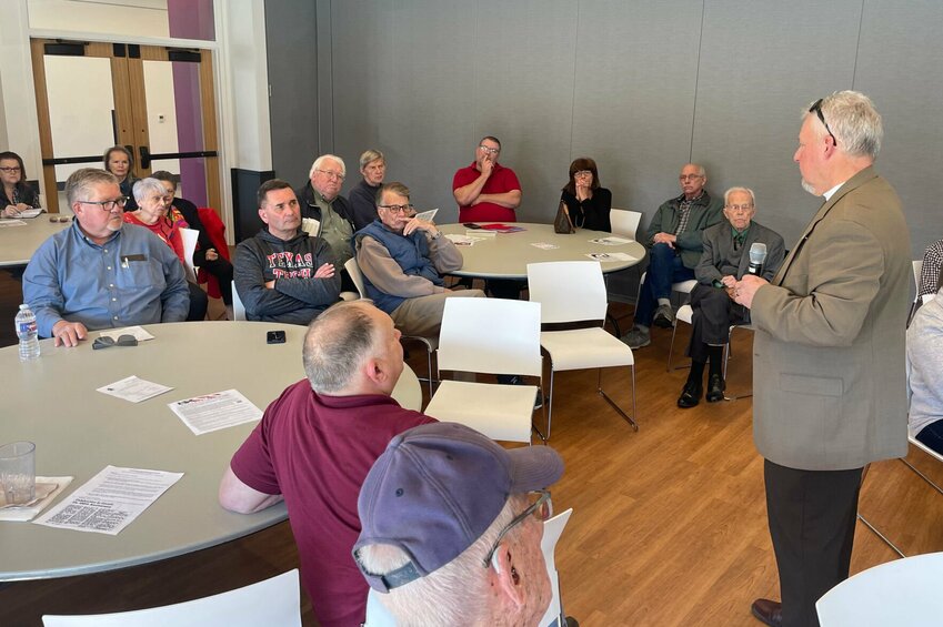 State Rep. Brad Pollitt, R-Sedalia, right, speaks at the Pettis County Pachyderm Club luncheon Friday, March 15 at the Heckart Community Center. State Rep. Rodger Reedy, R-Windsor, seated, was also on hand to give updates on this year's legislative session.   Photo by Chris Howell | Sedalia Democrat