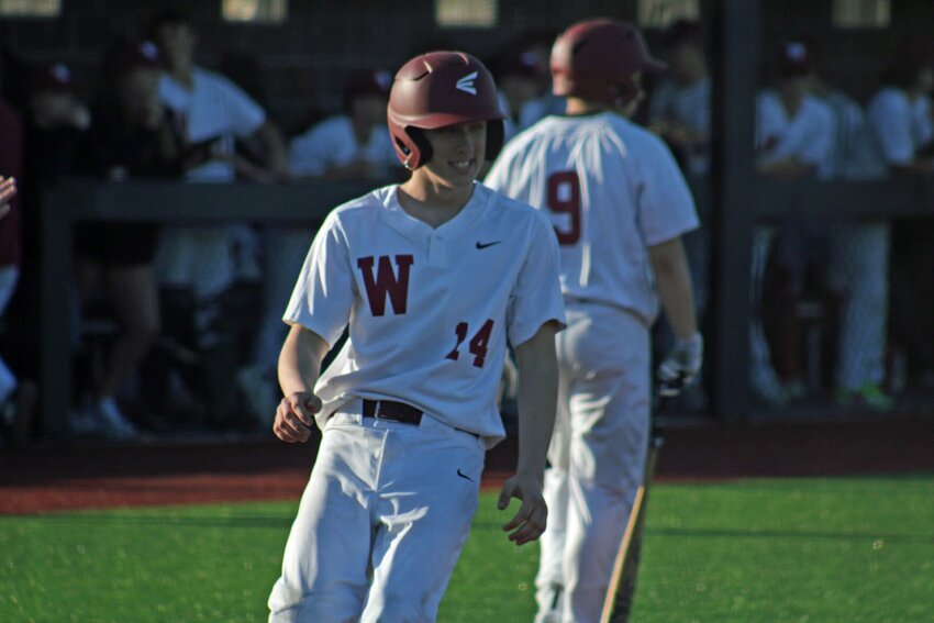 Warrensburg senior Aedan McCracken crosses home plate against Jefferson City on Tuesday, march 19, at the Warrensburg Activities Complex.