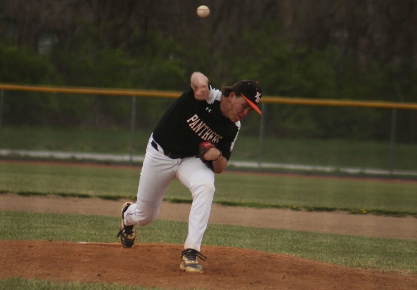 Knob Noster senior Trey Payne throws a pitch against Holen on Monday, March 25, at the Knob Noster Sports Complex. Photo by Joe Andrews | Star-Journal