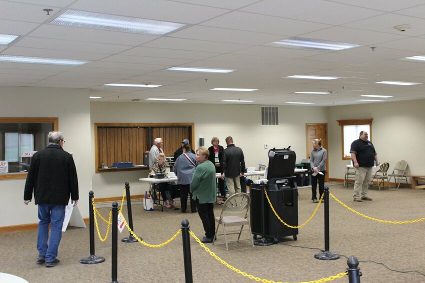 Warrensburg residents file into place to receive and cast their ballots in the municipal election on Tuesday, April 2, at the Grover Park Baptist Church Family Life Center in Warrensburg.&nbsp;