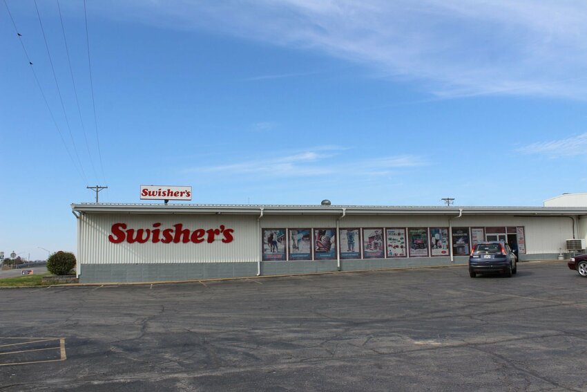 A car pulls in to park at the storefront of Swisher's on Friday, March 29 in Warrensburg. First opened in 1965 by Ray Swisher and his business partner Louis “Louie” Feldman, the store was then called Louie’s Farm & Home.