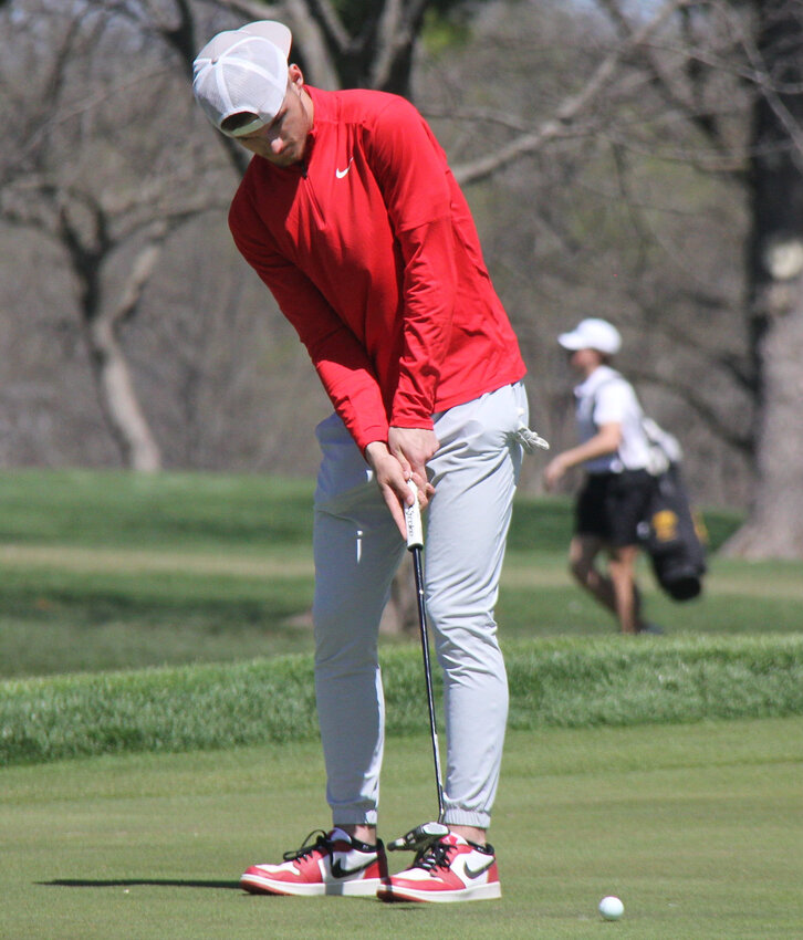 Warrensburg junior Kobe Westphal watches a put during the Smith-Cotton Classic on Monday, April 8, at the Sedalia Country Club.