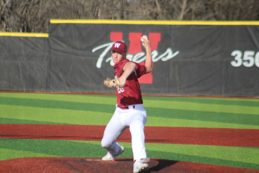 Warrensburg junior Eli Anderson throws a pitch against Bolivar on Tuesday, April 9, at the Warrensburg Activities Complex.