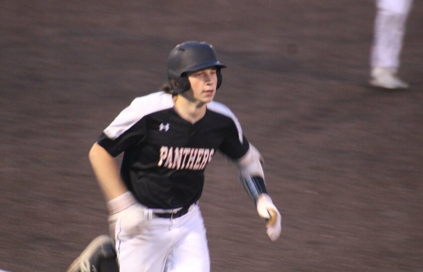 Knob Noster sophomore Brant Colvin runs to home plate after hitting a grand slam against Odessa on Wednesday, April 10, at Holden High School.