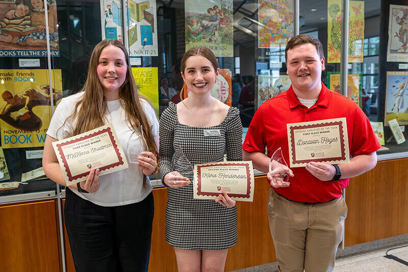 From left, three University of Central Missouri students, McKenna Strodtman, of Columbia; Kara Henderson, of Raytown, and Donovan Hoyes, of Sweet Springs, display certificates and trophies they received as top honorees during the Student Employee of the Year award ceremony at the James C. Kirkpatrick Library read and relax area.   Photo courtesy of the University of Central Missouri