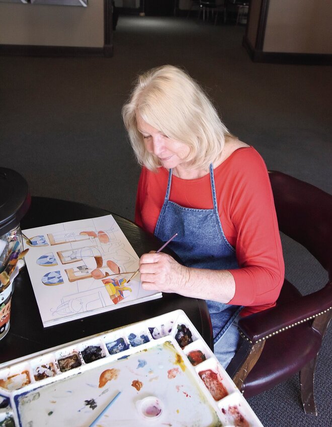 Warrensburg artist Jo Narron works on a watercolor on Saturday, April 13, at the Hayden Liberty Center in Sedalia. Narron is the Liberty Center Association A.I.R. artist for the month of April. She will work at the center each Saturday from 10 a.m. to 4 p.m.   Photo by Faith Bemiss-McKinney | Sedalia Democrat