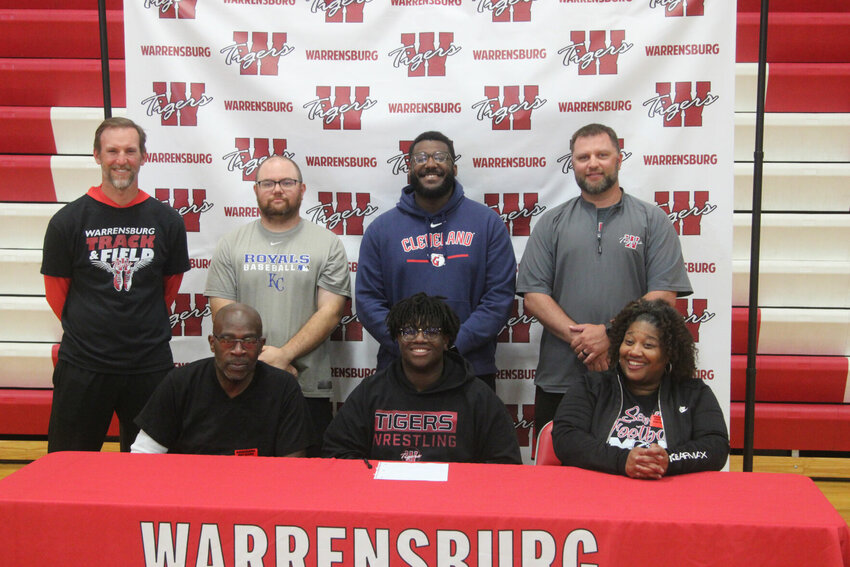 Warrensburg senior Tatum Davis signed his letter of intent to play football at William Woods University on Tuesday, April 23, at Warrensburg High School.