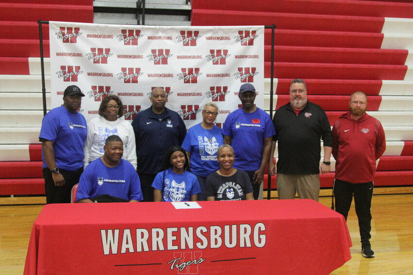 Warrensburg senior Adrianna Nunnelly signed her letter of intent to play basketball at Metropolitan Community College on Tuesday, April 23, at Warrensburg High School.