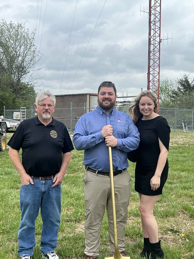 From left, Johnson County Central Dispatch Network and Systems Administrator Stephen Ewing, TUSA Consulting Services Radio Consultant Alan Talkington, and JCCD Executive Director Kimberly Jennings pose for a photo at the tower site on Tuesday, April 16.