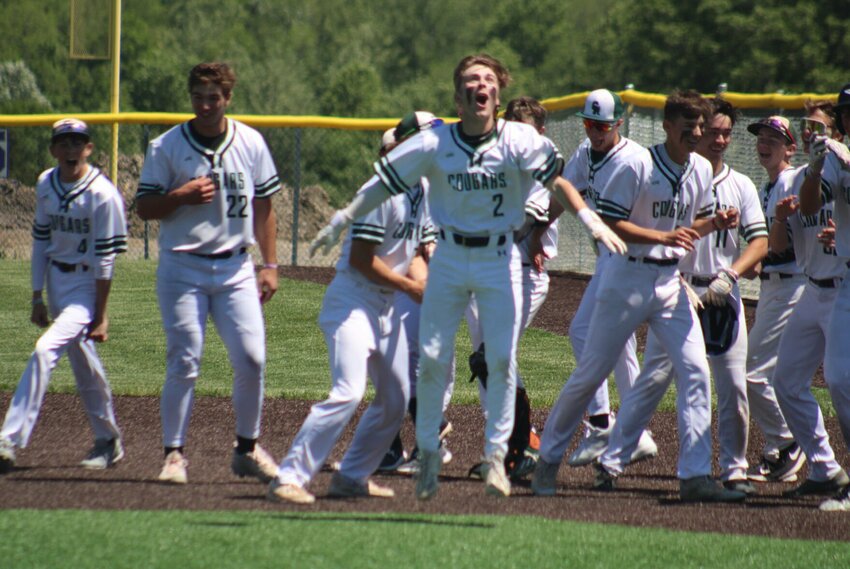 Crest Ridge senior Brady Hobbs celebrates his walkoff RBI signle against Midway on Thursday, May 9, in Pleasant Hill