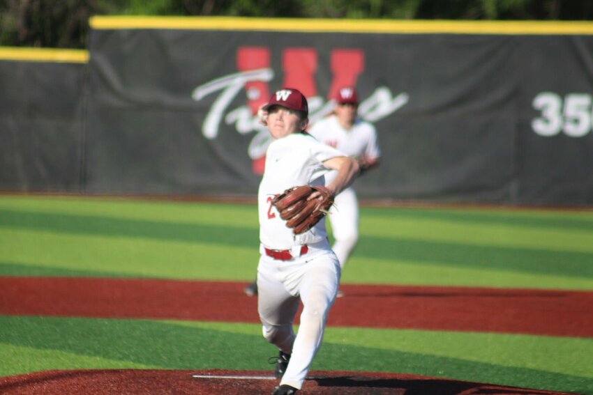 Warrensburg sophomore Braiden Schmitt throws a pitch against Knob Noster on Thursday, May 9, at the Warrensburg Activities Complex.