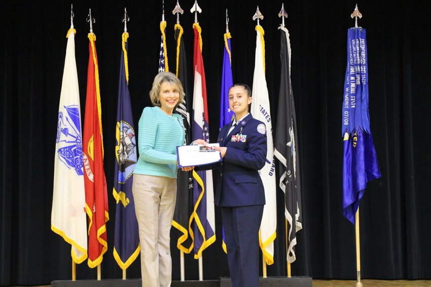Meryl Lin McKean, the Daughters of the American Revolution Warrensburg Chapter Americanism and National Defense Chair, attended the ROTC ceremony hosted Friday, April 12 at Knob Noster High School, where she presented the DAR pin to Nevaeh Wiltse, a Warrensburg High senior who will attend the University of Central Missouri.   Photo courtesy of Warrensburg Chapter of DAR
