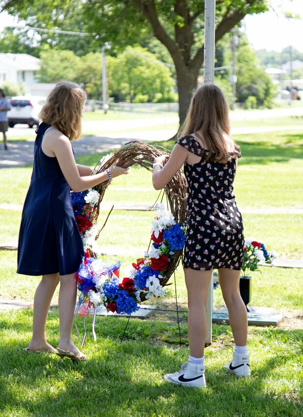 Two members of 2nd Lt. George A. Whiteman's family place a memorial wreath at his grave during the annual wreath-laying ceremony Saturday morning, May 18 in Memorial Park Cemetery in Sedalia. The event was hosted by the Sedalia Area Chamber of Commerce's Military Affairs Committee.


Photo by Nicole Cooke | Sedalia Democrat