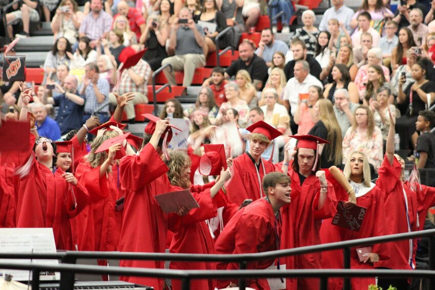Now-graduates of Warrensburg High School ready themselves to fling their caps to the sky on Saturday, May 18, at the Jerry M. Hughes Athletics Center.&nbsp;