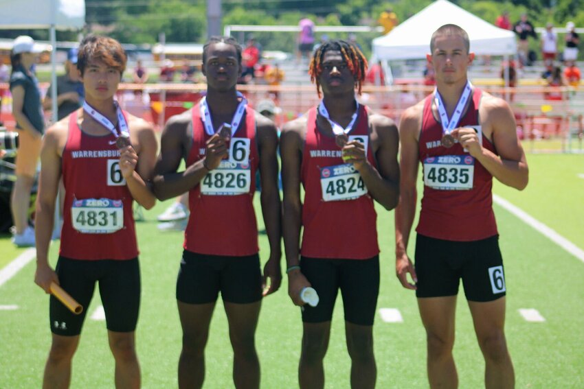 Warrensburg junior Amir Ramos, sophomore Seth Johnson, freshman Zanman Graham and sophomore Cruz Villegas pose for a photo with their MSHSAA Class 4 Championships 4x100 meter relay third-place medal Saturday, May 25, at Adkins Stadium.