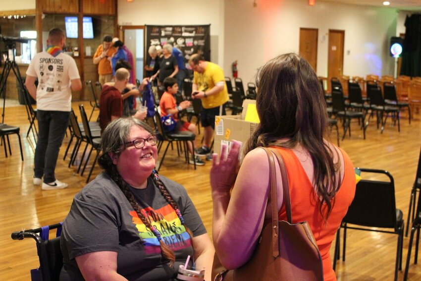 A Pride Fest attendee speaks with Missouri Governor candidate Crystal Quade on Saturday, June 1, at the Elks Lodge.&nbsp;