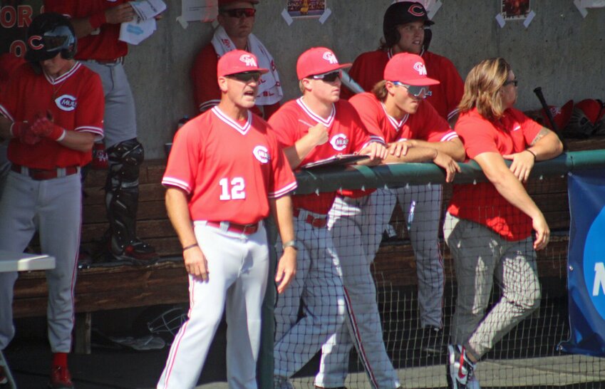 Central Missouri head coach Kyle Crookes instructs Mules baseball from the dugout against Arkansas-Monticello in the NCAA Division II Central Region championship game May 25, at Crane Stadium.
