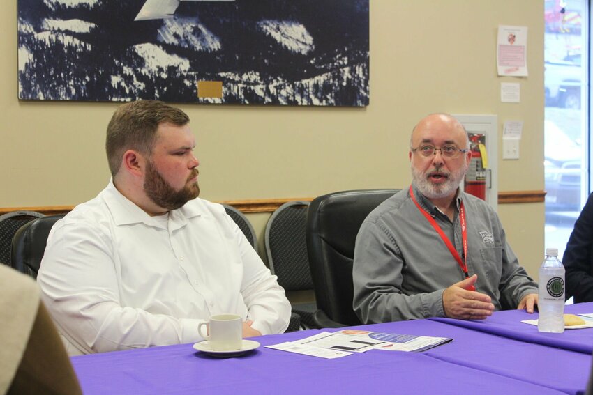 Missouri Department of Transportation Railroad Operations Manager Bryan Ross, right, and Assistant Legislative Liaison Patrick Flesch, left, speak to a panel of Warrensburg community leaders on Wednesday, July 24, at the Jack Moore Community Room.