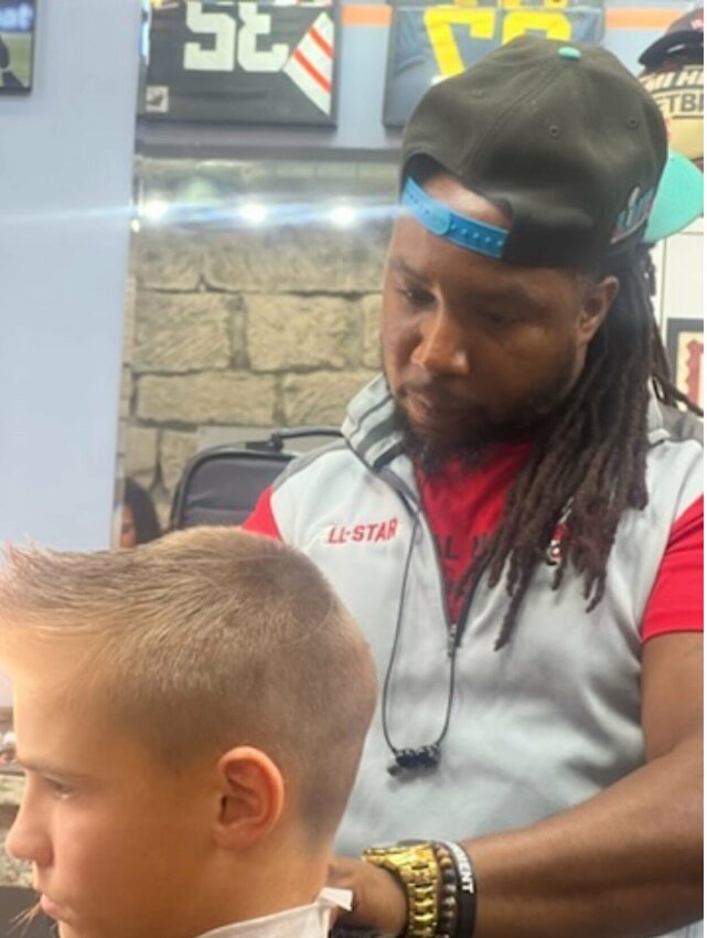 All Starz Barbershop owner Willie Taylor cuts the hair of a child for free during a past “Fresh 4 Success” event. The 2024 event will be its eighth annual and will run from 3 p.m. to 7 p.m. on Monday, August 12. 