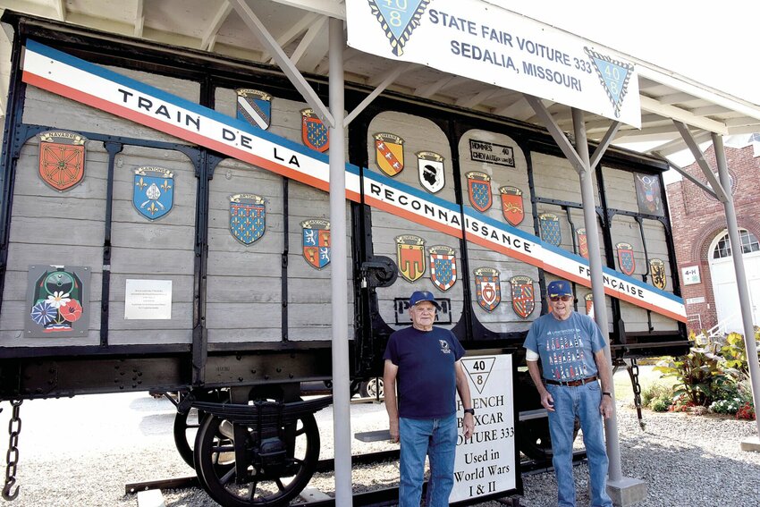 Voiture 333 40 &amp;amp; 8 Treasurer Ernie Parker, left and Passe Chef de Gare Don Barbour, stand beside the State Fair Voiture 333 Merci Train on Tuesday, Aug. 20. The 75th anniversary of the boxcar will be celebrated with a ceremony at 11 a.m., Saturday, Aug. 24 on the Missouri State Fairgrounds. The free event is open to the public.   Photo by Faith Bemiss-McKinney | Democrat