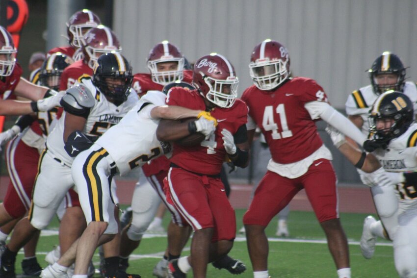 Warrensburg junior AJ Smith runs up field against Cameron on Friday, Sept. 6, at the Warrensburg Activities Complex.